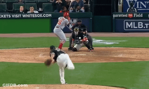 A Baseball Game Is Being Played In Front Of An Ad For Mlb GIF