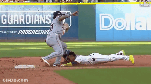 A Baseball Game Is Being Played In Front Of An Advertisement For Dollar General GIF
