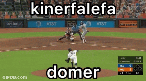 A Baseball Game Is Being Played In Front Of An At & T Ad GIF