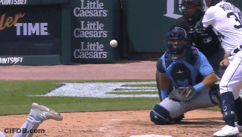 A Baseball Game Is Being Played In Front Of Signs For Little Caesars GIF