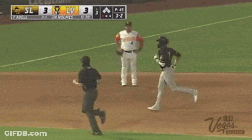 A Baseball Game Is Being Played With A Green Valley Grocery Advertisement On The Fence GIF