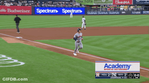 A Baseball Game Is Being Played With A Spectrum Ad In The Outfield GIF
