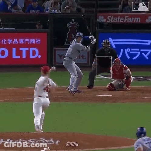 A Baseball Game Is Being Played With A State Farm Ad In The Background GIF