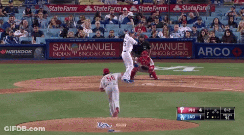 A Baseball Game Is Being Played With Ads For State Farm And Arco In The Outfield GIF