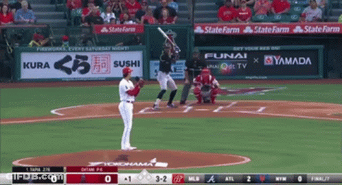 A Baseball Game Is Being Played With Advertisements For Kura Sushi Funai And Yamada On The Outfield Wall GIF