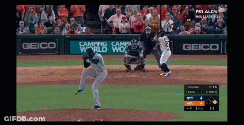 A Baseball Game Is Being Played With An Ad For Geico GIF