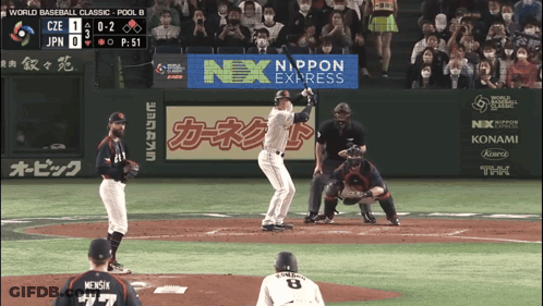 A Baseball Game Is Being Played With An Ad For Nex Express GIF