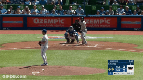 A Baseball Game Is Being Played With An Ad For Zempic GIF