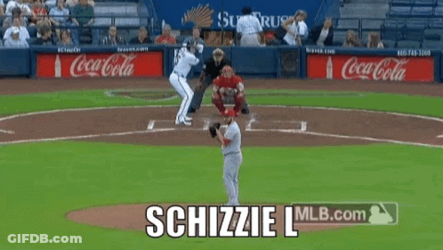 A Baseball Game Is Being Played With Coca-Cola Advertisements In The Outfield GIF