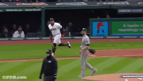 A Baseball Game Is Underway With A Banner That Says A Leader In Neurology On It GIF