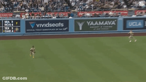A Baseball Game Is Underway With A Vividseats Ad On The Wall GIF
