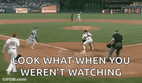 A Baseball Game With The Words Look What When You Weren T Watching GIF