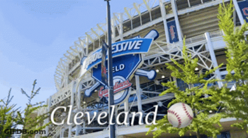 A Baseball In Front Of A Stadium That Says Cleveland On It GIF