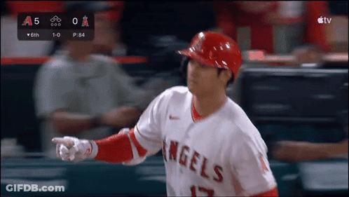 A Baseball Player For The Angels Is Pointing At Something In The Distance GIF