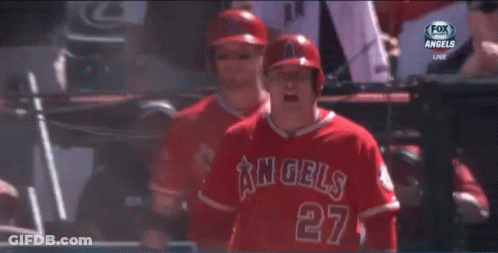 A Baseball Player For The Angels Is Standing In Front Of A Sign That Says Old Service GIF