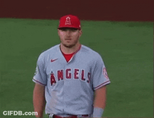 A Baseball Player For The Angels Is Standing On A Field . GIF