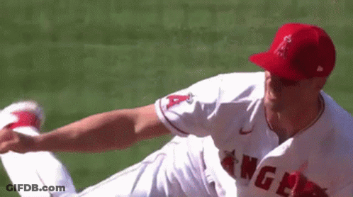A Baseball Player For The Angels Is Throwing A Baseball GIF