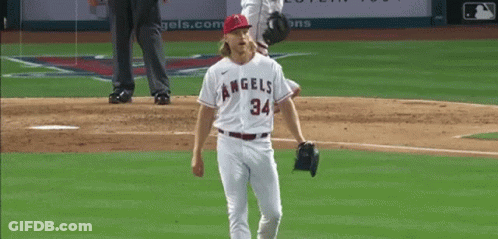 A Baseball Player For The Angels Stands On The Field GIF