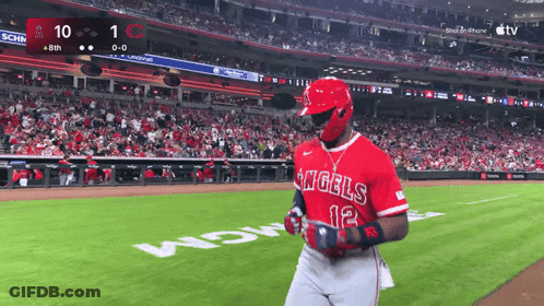 A Baseball Player For The Angels Stands On The Field During A Game GIF
