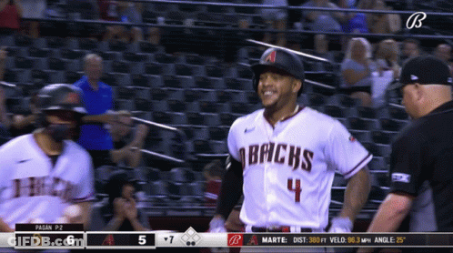 A Baseball Player For The Arizona Bricks Is Smiling And Talking To A Referee GIF