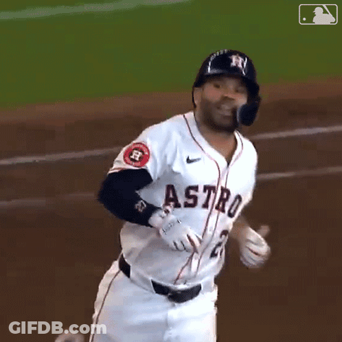 A Baseball Player For The Astros Is Running Towards The Base GIF