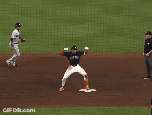 A Baseball Player For The Astros Is Standing On The Base GIF