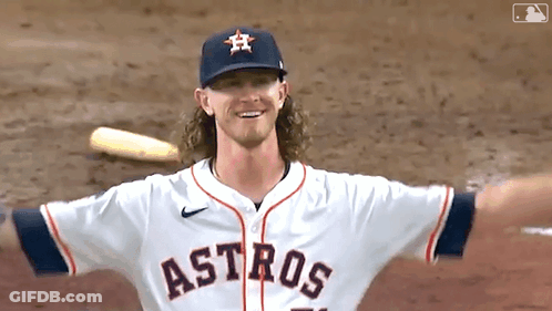 A Baseball Player For The Astros Is Standing On The Field GIF