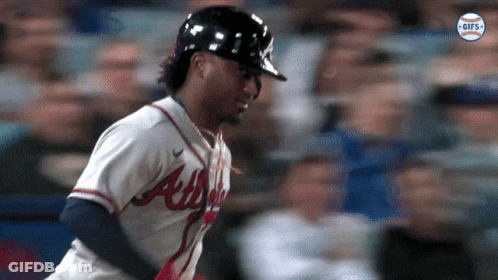 A Baseball Player For The Atlanta Braves Is Running GIF