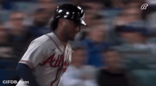 A Baseball Player For The Atlanta Braves Is Running GIF