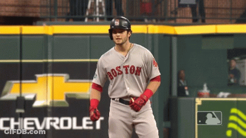 A Baseball Player For The Boston Red Sox Stands In Front Of A Chevrolet Sign GIF