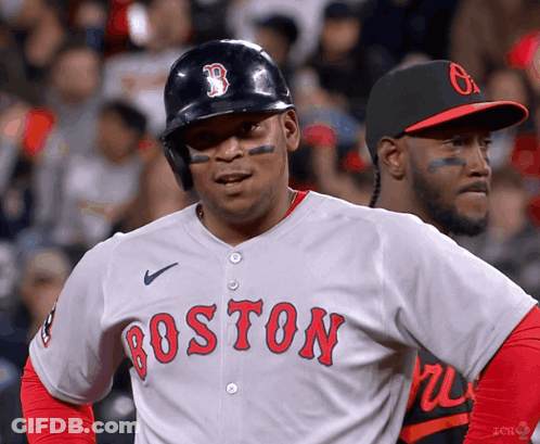 A Baseball Player For The Boston Red Sox Stands In Front Of Another Player GIF