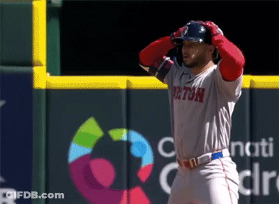 A Baseball Player For The Boston Red Sox Stands On The Field GIF