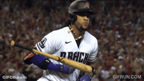 A Baseball Player For The Colorado Rockies Holds His Bat GIF