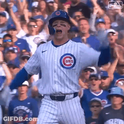 A Baseball Player For The Cubs Is Standing In Front Of A Crowd GIF