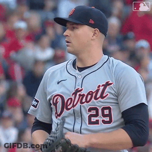 A Baseball Player For The Detroit Tigers Holds His Glove GIF
