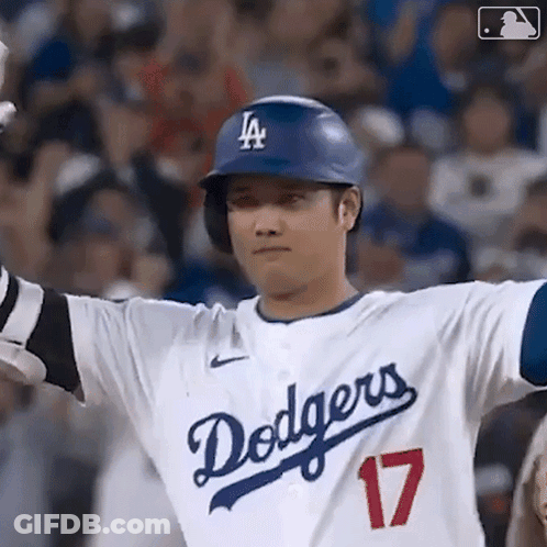 A Baseball Player For The Dodgers Is Wearing A Helmet And Gloves . GIF