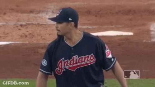 A Baseball Player For The Indians Is Getting Ready To Throw The Ball GIF