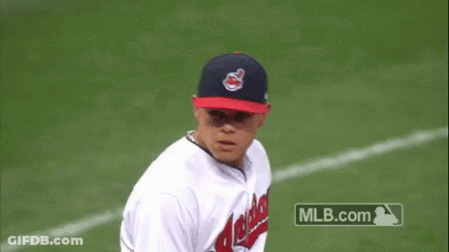 A Baseball Player For The Indians Is Throwing A Baseball GIF