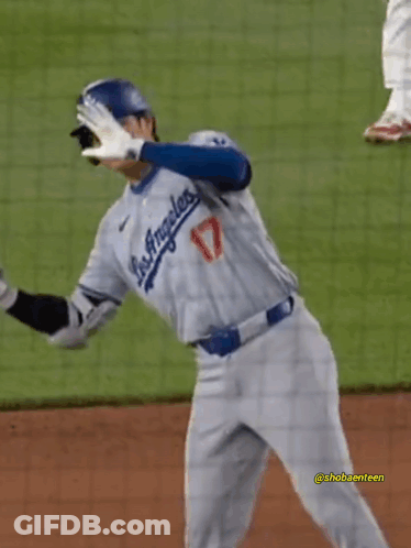 A Baseball Player For The Los Angeles Dodgers Is Standing On A Field GIF