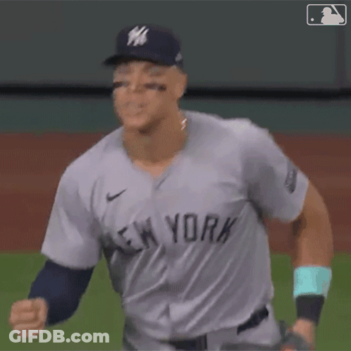 A Baseball Player For The New York Yankees Is Throwing A Ball GIF