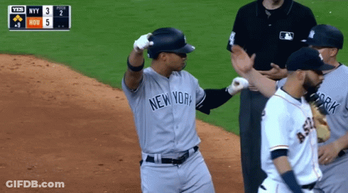 A Baseball Player For The New York Yankees Stands On The Field GIF