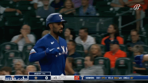 A Baseball Player For The Texas Rangers Is Walking Towards The Base GIF