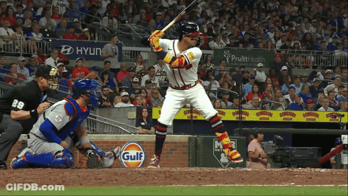 A Baseball Player Getting Ready To Bat With A Gulf Sign In The Outfield GIF