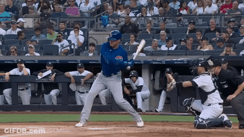 A Baseball Player Getting Ready To Hit A Ball With A Chicago Cubs Jersey On GIF