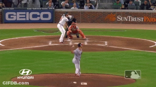 A Baseball Player Getting Ready To Hit The Ball With A Hyundai Logo Behind Him GIF