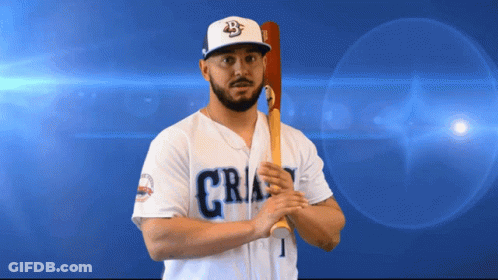 A Baseball Player Holding A Bat With The Number 1 On His Shirt GIF