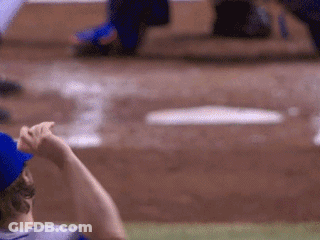 A Baseball Player In A Blue Hat Is Looking At The Bases GIF