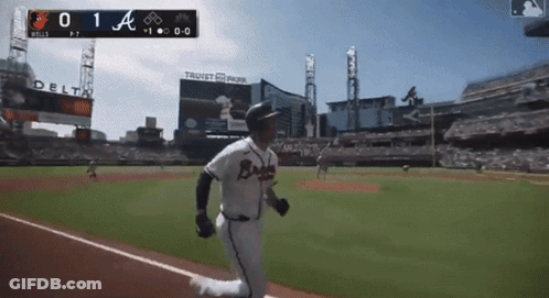 A Baseball Player In A Braves Uniform Is Running On A Baseball Field GIF