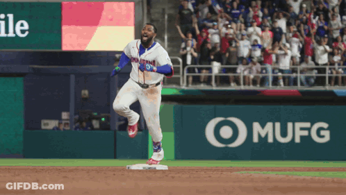 A Baseball Player In A Dominican Jersey Is Running Towards Home Plate GIF
