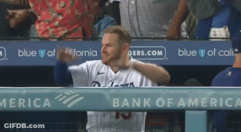 A Baseball Player In A Dugout With A Bank Of America Ad Behind Him GIF